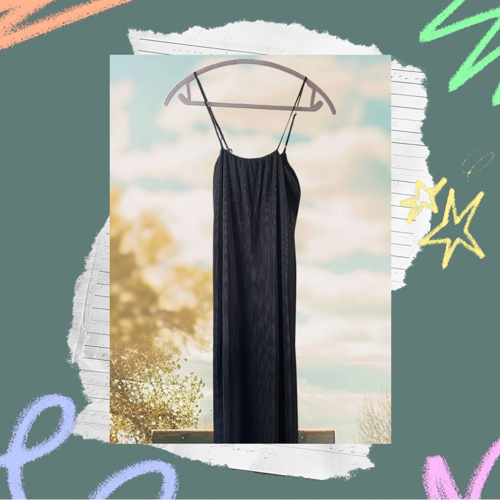 Beautiful classic black mid dress, strappy and delicate.
